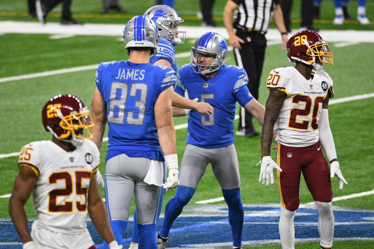 Prater celebrates with teammates after kicking game-winning field goal against Washington. 